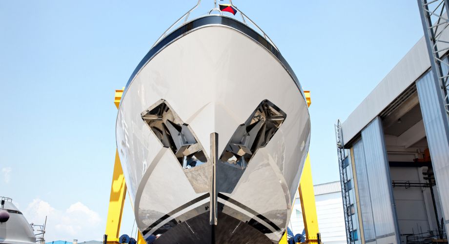 Introduction to Yacht Design | YATCO The bow of a large yacht under maintenance. Explore the art and science of yacht design, from history and principles to trends, innovations, and creating luxury yachts.