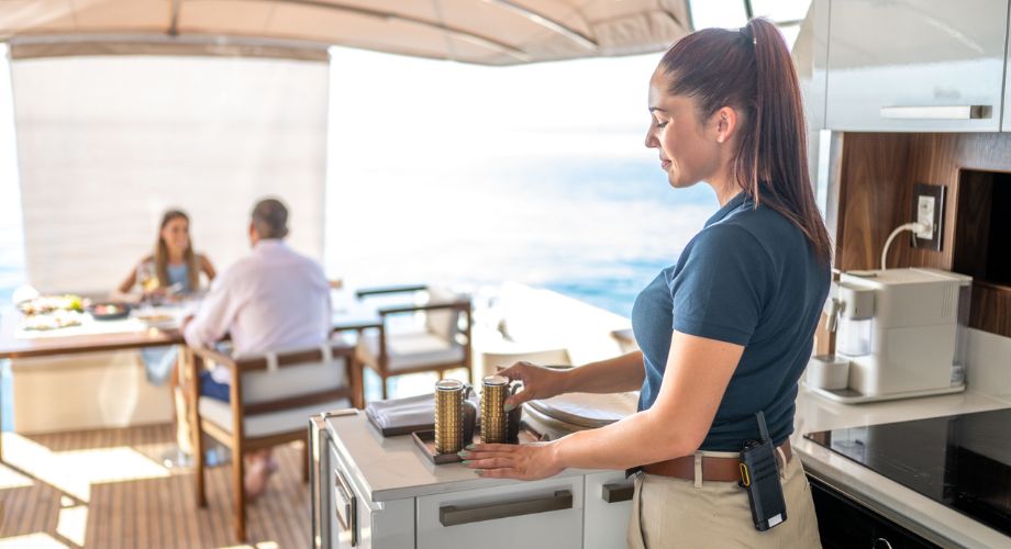 Yacht Investment | YATCO A yacht crew on a luxury yacht. Is yacht investment worth it? Discover ownership models, charter income tips, & how to make yacht purchases work for your business goals.